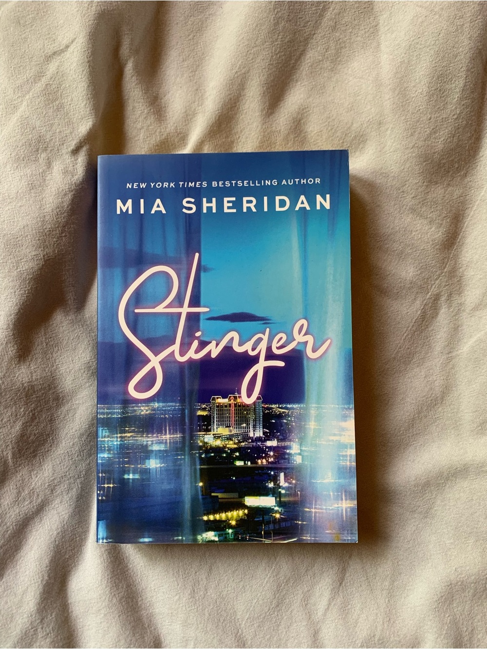 Stinger by Mia Sheridan in paperback